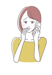 携帯電話で話す女性