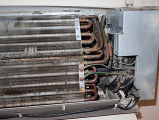 Dirty fan coil of air conditioner indoor unit. Maintaining the air conditioner concept.