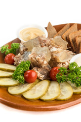 jellied meat with bread and vegetables and herbs in a plate Russian snack isolate on a white background