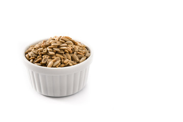 Sunflower seeds in bowl isolated on white background. Copy space	