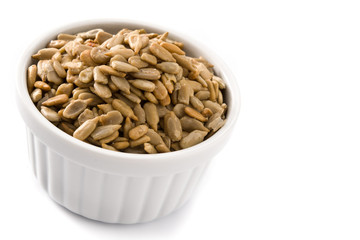 Sunflower seeds in bowl isolated on white background. Copy space	