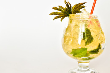 Glass glass of lemonade with mint leaves and lemon on a white background. place for text