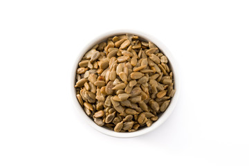 Sunflower seeds in bowl isolated on white background. Top view	