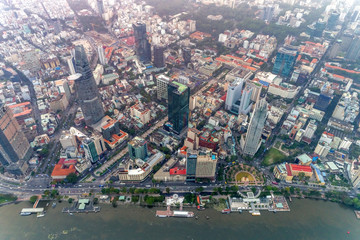 Top view aerial photo from flying drone of a Ho Chi Minh City with development buildings, transportation, energy power infrastructure. Financial and business centers in developed Vietnam.
