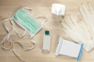 Various protective equipment for sterilization and prevention of virus infection. Hand sanitizer, surgical mask, latex gloves, antibacterial wipes