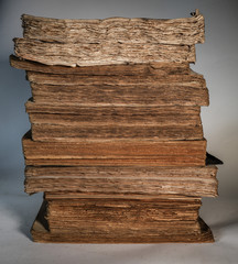 Antique papers. Old aged, stained, vintage and ruined pages. Books from the 1800s.