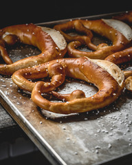 Side view of freshly baked pretzels, which come directly from the oven