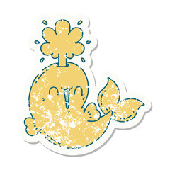 grunge sticker of tattoo style happy squirting whale character