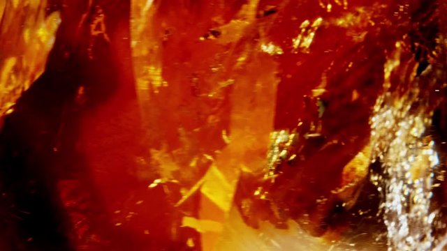 Amber. Beautiful colored pieces of amber. Amber texture. Red-yellow amber with bubbles, waves, divorces and color transitions. Natural mineral Sunstone. Material for jewelers. Crystal.