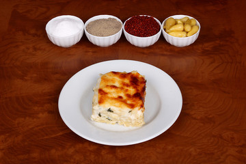 perfect turkish food pasta oven spicy on white plate on wooden table