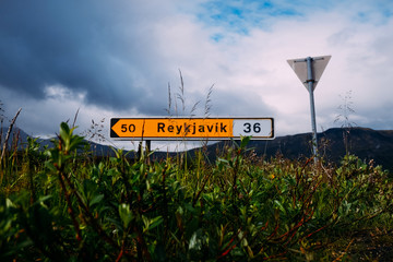 road sign direction indicator to the capital of Iceland Reykjavik i