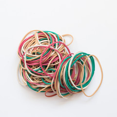 A pile of colorful rubber elastics isolated on white background
