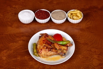 excellent turkish food chicken leg on a spicy white plate
