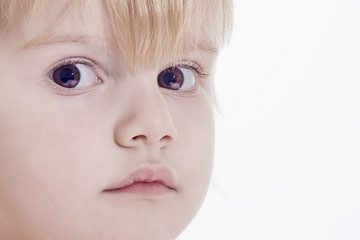 close up face portrait of a child with light hair