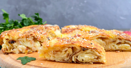 Burek Turkish pie. Lavash puff pie with cheese and sesame seeds