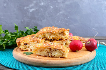 Burek Turkish pie. Lavash puff pie with cheese and sesame seeds