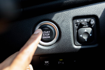 Start stop engine button on a modern car dashboard.