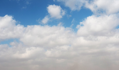 Fototapeta premium clouds swiftly swim through the blue sky of the day