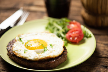 Hamburger with fried egg closeup