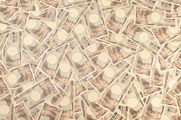 10,000 Yen Banknotes - Background with several banknotes of ten thousand yen banknotes (front). Japanese money. Concept: Financial abundance. Horizontal shot.