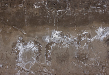 smudges, cracks and white mold on a concrete wall