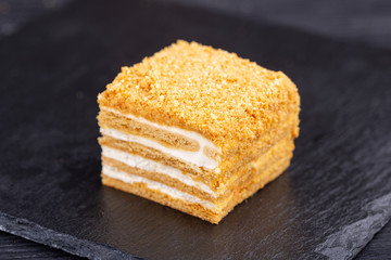 Cake honey with cream, nuts and honey crumb
