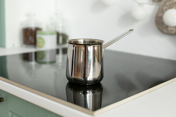 Coffee manually brewed in turkish coffee pot