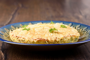 Turkish berek with cheese on a blue dish.