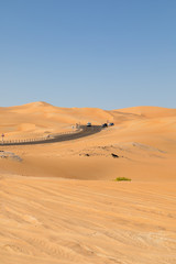 Fototapeta na wymiar Road to nowhere at Rub' al Khali desert in UAE