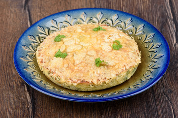Turkish berek with cheese on a blue dish.
