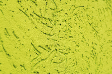 yellow-green cement wall, building facade as a color relief texture close-up, copy space