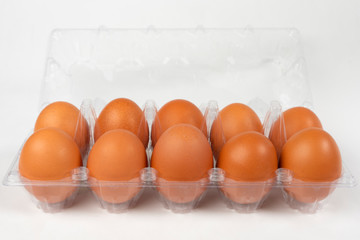 Eggs in a plastic package with isolated white background.