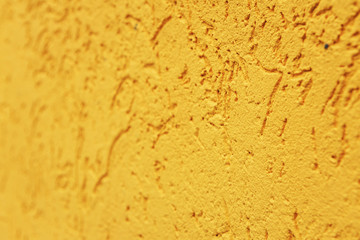 orange cement wall, building facade as a color relief texture close-up, copy space