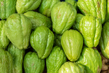Freah chayote or Sechium edule on market for sale.Freah chayote background.Is a very useful vegetable.