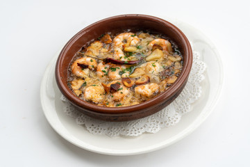 Shrimp Pil Pil with olive oil and garlic cooked in a clay pot dish