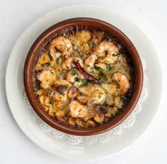Shrimp Pil Pil with olive oil and garlic cooked in a clay pot dish