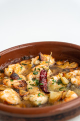 Shrimp Pil Pil with olive oil and garlic cooked in a clay pot dish