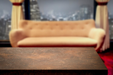 Fototapeta na wymiar Wooden desk of free space and sofa in home interior 