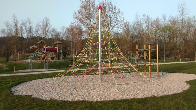 Empty children's playground with warning tape during COVID-19 epidemics 