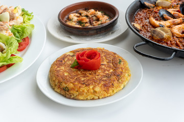Spanish food together in one shot, paella, Tortilla espanola, Gambas Pil Pil, Ensalada de Pescado