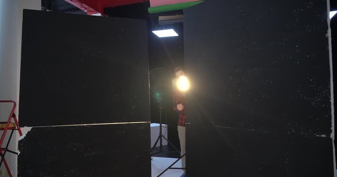 Photo Studio light shooting reflector. Camera movement, flare