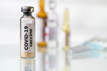 Conceptual image. Vaccine bottle to protect from Covid-19. Healthcare and medical concept. Closeup