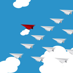 Leadership concept. Red paper leader airplane flying on blue sky and white cloud.