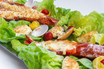 An assortment of baked seafood with cream and cheese