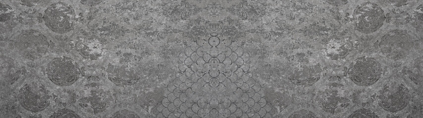Old gray vintage shabby patchwork motif tiles stone concrete cement wall texture background banner	