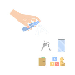 hand with a sanitizer disinfects keys, toys, wallet and phone