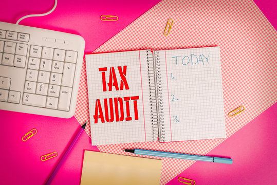 Conceptual hand writing showing Tax Audit. Concept meaning examination or verification of a business or individual tax return Writing equipments and computer stuff placed on plain table