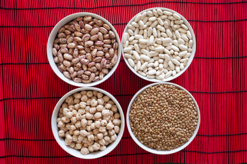 beans, chickpeas and lentils in different  bowls, with copy space for your text