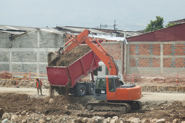 Excavation work with tippers and backhoe.