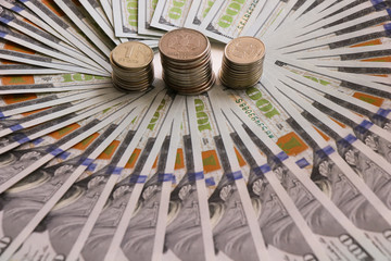 Russian coins on the background of a dollar bill. Russian money. Dollar. Ruble. Economic relations.